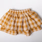 FALDA CUADROTES MOSTAZA